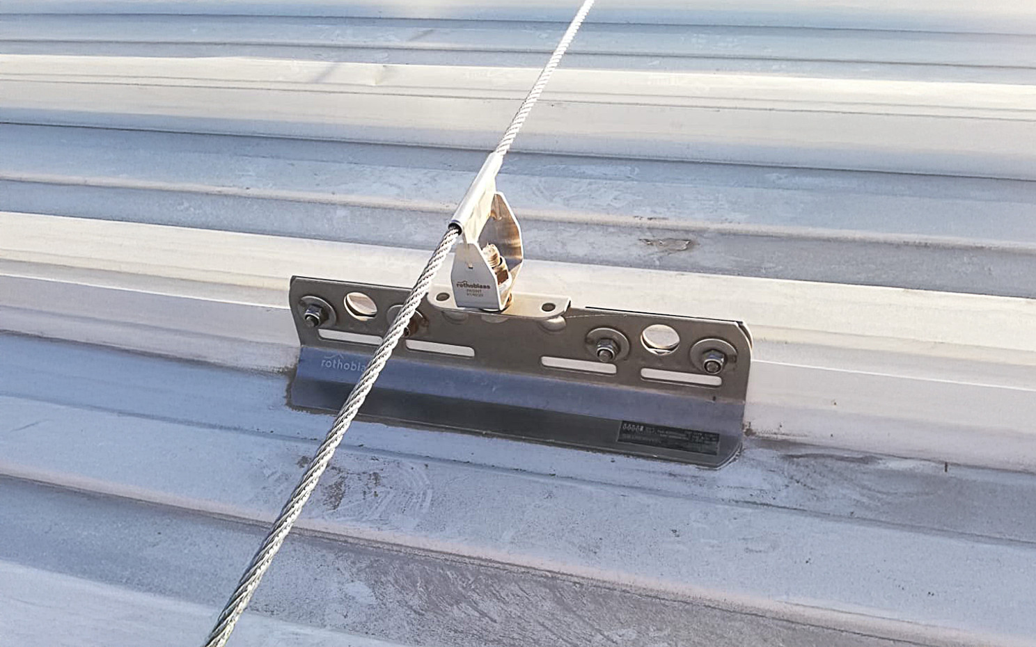Anchor point installed on standing seam metal roof typical of Latin American constructions